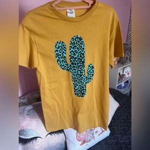 Mustard yellow and turquoise cactus design in a unique animal print.